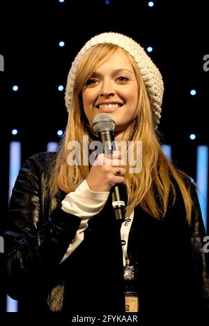 BBC Radio DJ Fearne Cotton has got the right idea with her big fluffy white  hat and scarf during a snowy and cold day in London. The radio host left  work with