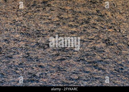 Gray and brown stone granite textured abstract wall background.