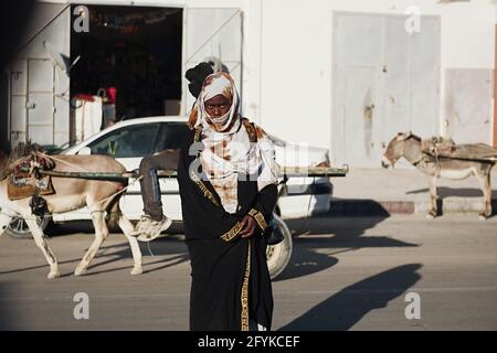 Nouadhibou, Mauritania, JANUARY 18, 2020: Portrait of a tribal African woman decorated with traditional colorful beads. Stock Photo
