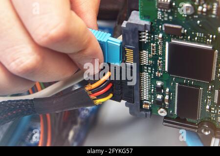 Inside computer system unit are installed HDD and connected to motherboard. Stock Photo