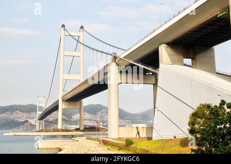 Hong Kong's Tsing Ma Bridge, one of the world's longest suspension bridges, and the longest in the world carrying rail traffic.. The bridge is an impo Stock Photo