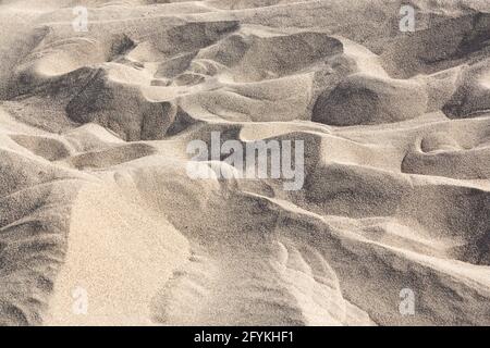 Small valleys and hills in the desert sands of the Taklamakan. Stock Photo