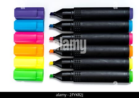 Set of highlighter markers sorted aligned and uncovered on white background. Stock Photo