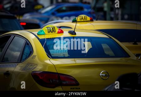 Bucharest, Romania - May 27, 2021: Taxi cab in traffic on a boulevard in Bucharest. Stock Photo