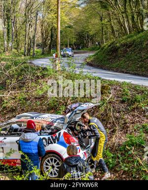 ZAGREB, CROATIA - Apr 23, 2021: Group of people helping race car get back on track from ditch. Ford fiesta driven by Stan Schwab at WRC Croatia Rally Stock Photo