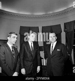 1 December 1961 President John F. Kennedy meets with Publisher of News Ltd. of Australia, Rupert Murdoch (right), and New York reporter for the Daily Mirror, Zell Rabin. Oval Office, White House, Washington, D.C..