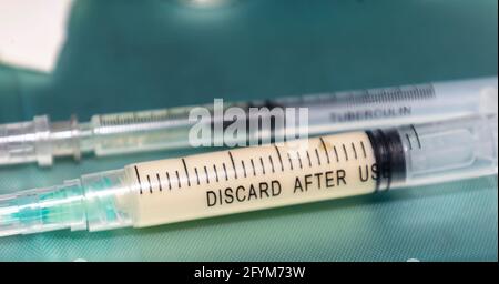 Two syringes lying on a medical tray with anesthesia during a complex surgical procedure Stock Photo