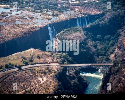 Victoria Falls Waterfall with Bridge over the Zambezi River connecting Zimbabwe and Zambia, Africa