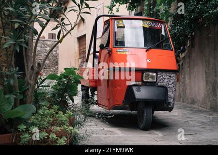 Vintage Piaggio Ape 50 commercial motorcycle on the streets of