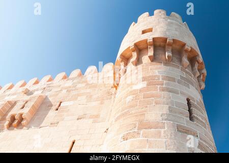 Tower of the Citadel of Qaitbay or the Fort of Qaitbay in Alexandria, Egypt. It is a 15th-century defensive fortress located on the Mediterranean sea Stock Photo