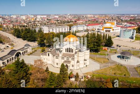 View from drone of modern landscape of Georgian port city of Poti overlooking residential areas and Orthodox Cathedral in Neo-Byzantine style on sunny Stock Photo