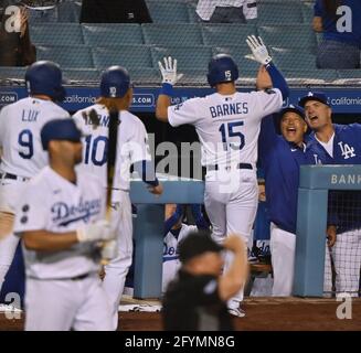 Los Angeles, United States. 19th Aug, 2021. Los Angeles Dodgers' short stop  Corey Seager (5) celebrates with manager Dave Robets (30) after hitting a  two-RBI home run off Pittsburgh Pirates' relief pitcher