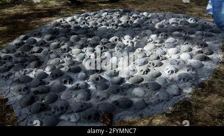 Skulls on the ground sculpture installation at Tuska Open Air Festival in Helsinki Finland Stock Photo