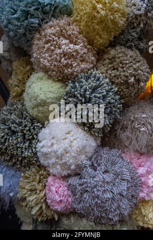 Rheinfelden, Switzerland - November 25, 2020: Detail of a decorative wreath on the front door of the house, made of woolen balls in different colors Stock Photo