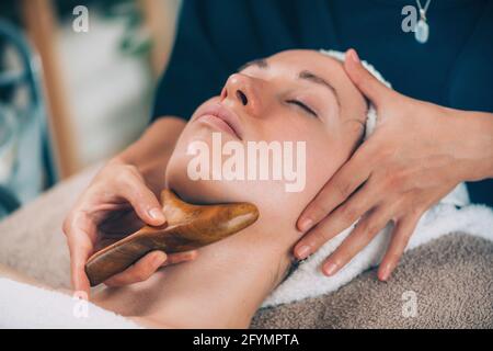 Lymphatic drainage face massage Stock Photo