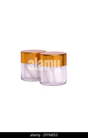two jars with white pills on a white background Stock Photo