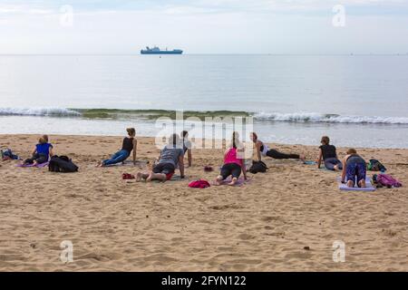 Bournemouth, Dorset UK. 29th May 2021. UK weather: warm and sunny at Bournemouth beaches, as people flock to the seaside to enjoy the sunshine, getting there early to get a good spot, for the start of the long Bank Holiday weekend, as more people take staycations because of restrictions on foreign travel due to Covid.  Credit: Carolyn Jenkins/Alamy Live News Stock Photo