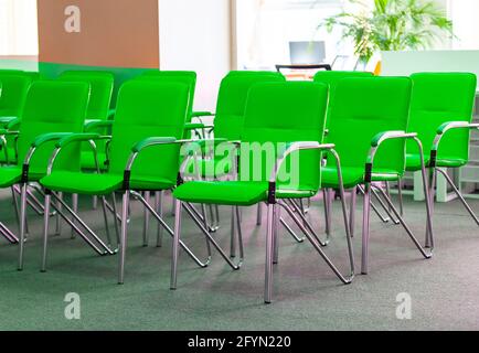 Therow of green office chairs in office. Selective focus Stock Photo