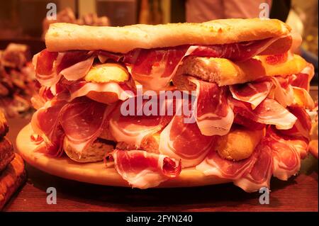 Stack of serrano iberico ham sandwiches on display at a local sandwich shop in Bilbao, Biscay, Basque Country, Spain Stock Photo