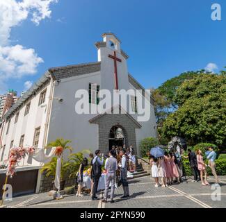 22 5 2021 friends and relatives take group photos with Bride and groom after wedding ceremony in small church in Hong Kong Stock Photo