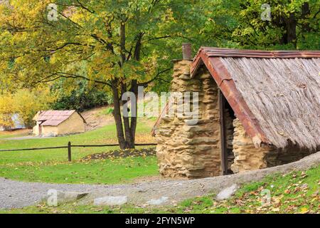 Old gold miners' huts in the Arrrowtown Chinese Settlement, Arrowtown, New Zealand. They were built by Chinese immigrants in the 1880s Stock Photo