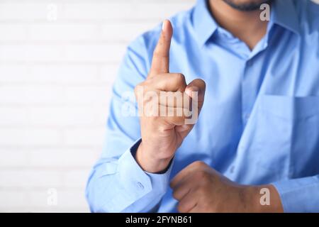 young man hand index finger pointing up. Stock Photo