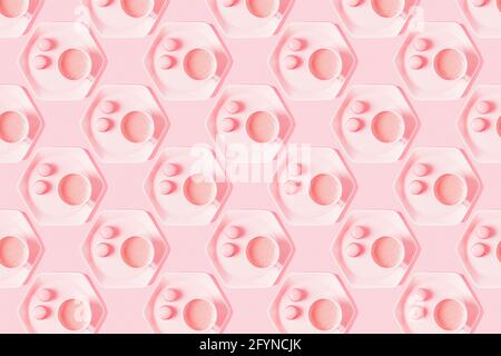 Pattern of coffee with macarons on pastel pink background. Stock Photo