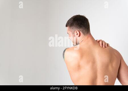 The muscles of the neck in a man on a white background are hurt back sore  spine male young medical, hand Tension sickness, back suffer attractive  Stock Photo - Alamy