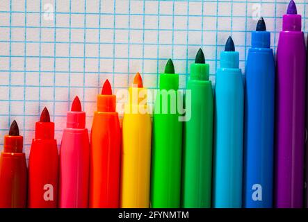 Image of opened multicolored markers on notebook, nobody Stock Photo