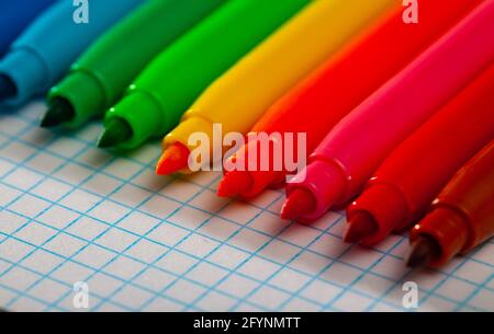 Image of opened multicolored markers on notepad, nobody Stock Photo