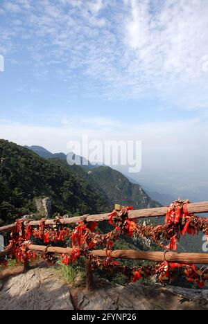 Lushan Mountain in Jiangxi Province, China. Viewpoint on Mount Lu with lovers locks and red ribbons. Stock Photo