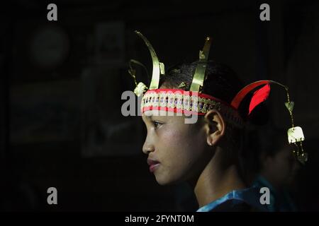 Portrait of a woman in traditional clothing as she is waiting to participate in a show of traditional game and 'caci' (Flores Island's traditional whip fight, martial art) in Liang Ndara village, Mbeliling, West Manggarai, Flores, East Nusa Tenggara, Indonesia. Stock Photo