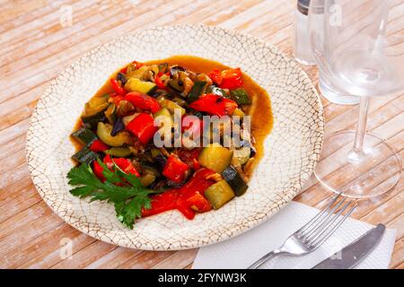 Stew with peppers, zucchini and zucchini in plate.Traditional Hungarian dish called lecho Stock Photo