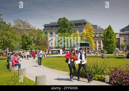 City Centre, Edinburgh, Scotland, UK weather. 29th May 2021.  After very misty morning a sunny afternoon in city centre for  those who ventured out to shop and relax with friends. Pictured: People in St Andrews Square. Credit: Arch White/Alamy Live News Stock Photo