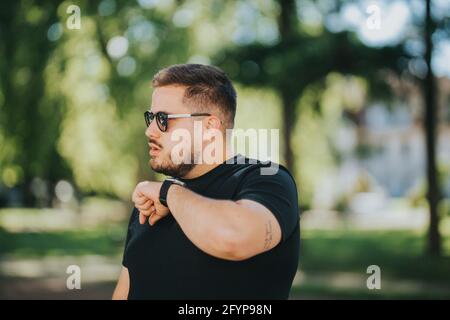 Male is using a voice command recorder on the smartwatch Stock Photo