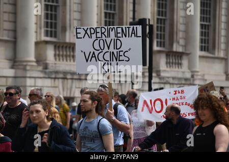 London, UK. 29th May, 2021. Unite for Freedom no COVID passports protestors holding banners march for freedom against Vaccine Passports in London, on 29th May 2021. Credit: Picture Capital/Alamy Live News