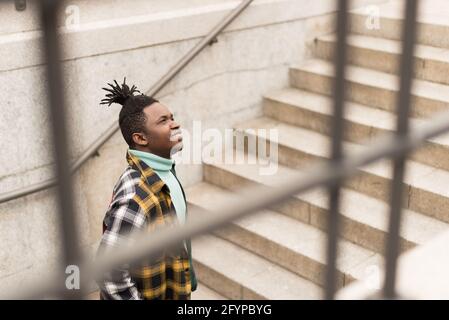 Black man on a stairs in the city. Stock Photo