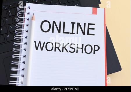 Text sign showing Online Workshop. Conceptual photo intensive discussion and activity on a particular subject Notebook and laptop computer. Stock Photo