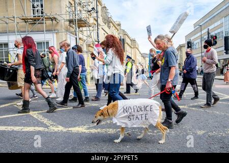 Bath, Somerset, UK. 29th May, 2021. Kill the bill protesters carrying anti government placards and signs are pictured as they take part in a kill the bill protest march through the centre of Bath. The protesters took to the streets to demonstrate about the police, crime, sentencing and courts bill which the UK government wants to bring into force.The bill includes major government proposals on crime and justice in England and Wales.  Credit: Lynchpics/Alamy Live News