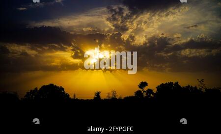 Dark red apocalyptic sky, judgement day, end of world, eternal damnation, dark scary silhouettes Stock Photo