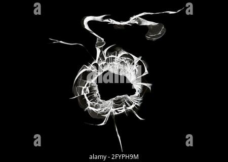 Hole in the window, illustration of broken glass crack texture isolated on black background Stock Photo