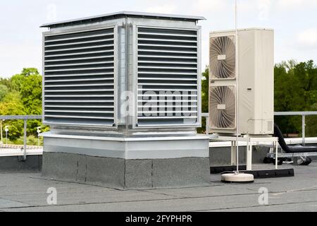 The external units air conditioning and ventilation systems installed on the flat roof Stock Photo