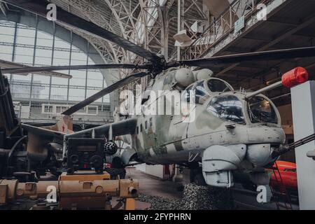Brussels, Belgium - August 17, 2019: Mil Mi-24D HIND-D attack helicopter in The Royal Museum of the Armed Forces and Military History, famous military