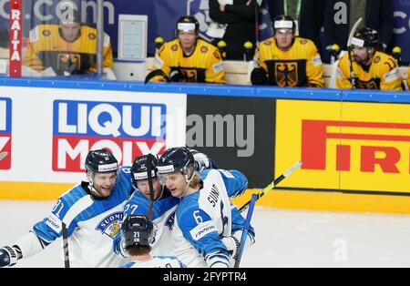 Riga, Latvia. 29th May, 2021. Ice hockey: World Championship, preliminary round, group B, Germany - Finland: Fannland's players cheer. Credit: Roman Koksarov/dpa/Alamy Live News Stock Photo