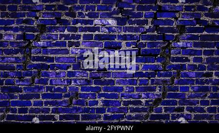 Dark blue brick wall with a crack. Copy space. Antique wall background. Brick wall texture in blue. Stock Photo
