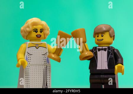 LUTON, UNITED KINGDOM - May 20, 2020: Celebrating with a drink as represented with Lego figures Stock Photo