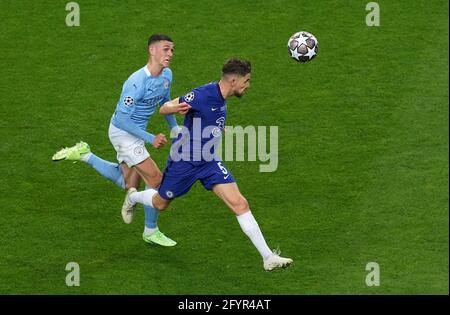 Manchester City's Phil Foden (left) and Chelsea's Jorginho in action during the UEFA Champions League final match held at Estadio do Dragao in Porto, Portugal. Picture date: Saturday May 29, 2021. Stock Photo