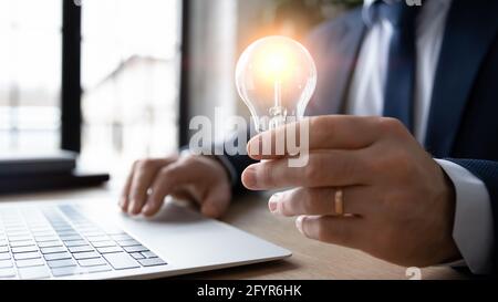 Business leader working on new startup idea of saving energy Stock Photo