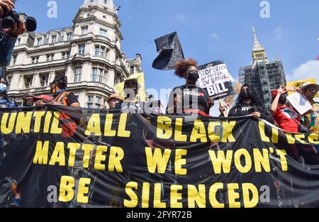 London, UK. 29th May, 2021. Black Lives Matter demonstrators march through Parliament Square during the Kill The Bill protest.Various groups of protesters marched through Central London in opposition to the Police, Crime, Sentencing and Courts Bill. Credit: SOPA Images Limited/Alamy Live News Stock Photo