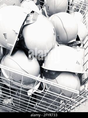 a heap of construction helmets Stock Photo